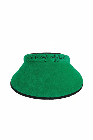 Green visor with 'out of office' text on a white background