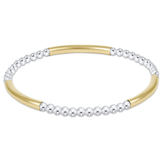 Two-toned gold and silver beaded bracelet on a white background