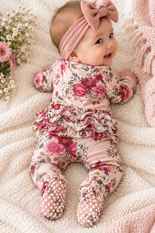 BABY ON HER TUMMY SHOWING THE BACK SIDE OF THE OUTFIT. 