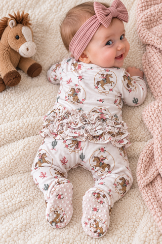 The back side of the baby showing ruffled bottom. 