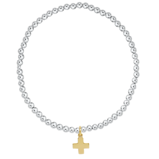 Silver beaded bracelet with a gold cross charm on a white background