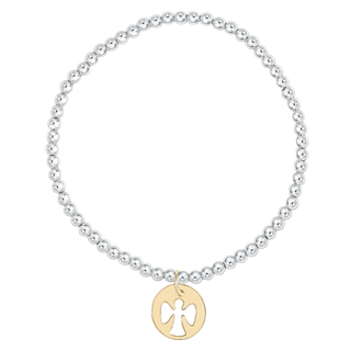Silver beaded bracelet with a gold charm on a white background