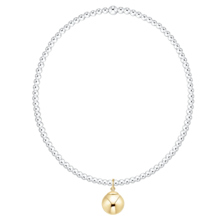 Silver beaded necklace with a gold pendant on a white background