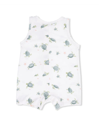 White romper with turtle pattern on a white background