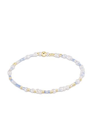 Beaded bracelet with gold accents on a white background