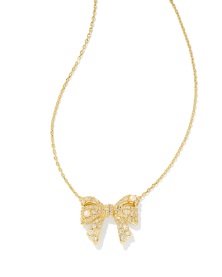 Gold bow-shaped pendant necklace on a white background