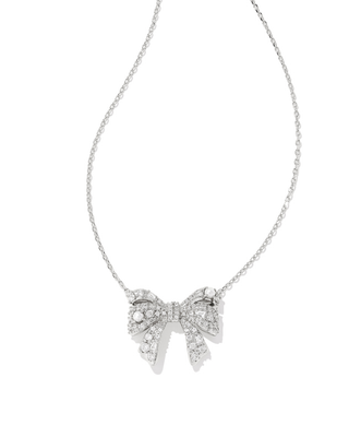 Silver bow-shaped necklace on a white background