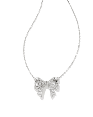 Silver bow-shaped necklace on a white background