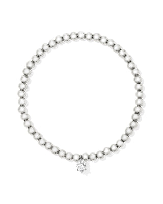 Beaded bracelet with a diamond charm on a white background