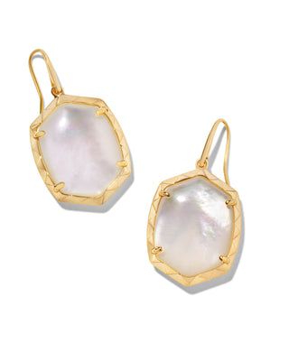 Gold earrings with large white gemstones on a white background