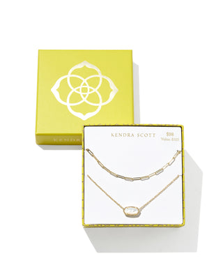 Kendra Scott Elisa and Courtney gold necklace gift set featuring a delicate chain necklace with a white stone pendant and a gold elongated-link chain necklace, displayed in a branded yellow gift box. Marked $98 with a $125 value.