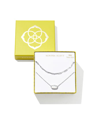 Kendra Scott Elisa and Courtney silver necklace gift set featuring a delicate chain necklace with a white stone pendant and a silver elongated-link chain necklace, displayed in a branded yellow gift box. Marked $98 with a $125 value.