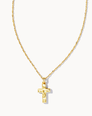 Gold cross necklace on a white background