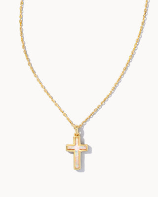 Gold cross necklace on a white background