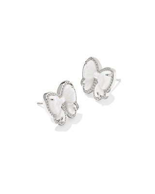 white bow-shaped silver earrings on a white background