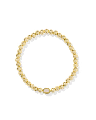 Gold beaded bracelet on a white background