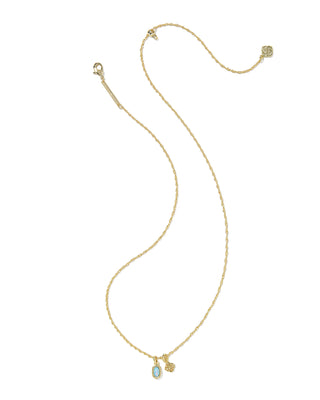 Gold necklace with small charms on a white background