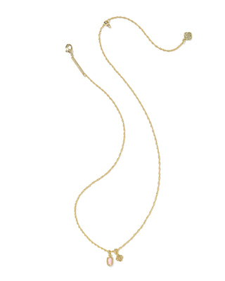 Gold necklace with small charms on a white background