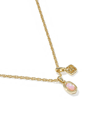 Gold necklace with pink gemstones on a white background