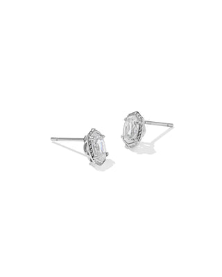 Teardrop-shaped earrings with black stones on a white background with measurement scale.