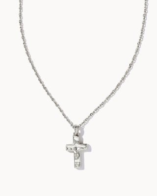Silver cross necklace on a white background