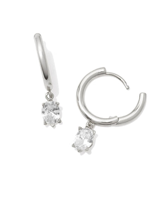 Silver hoop earrings with small round gemstones on a white background