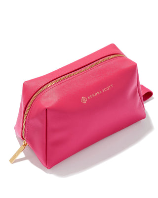Pink cosmetic bag with gold zipper on a white background