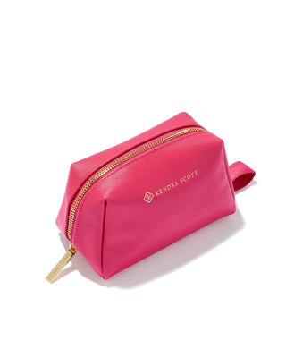 Pink cosmetic bag with gold zipper on a white background