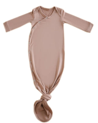 Brown baby knotted gown on a white background