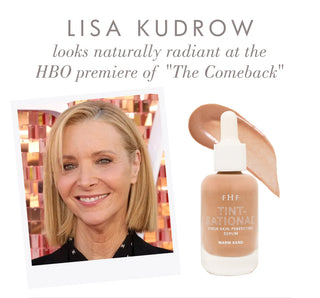 Bottle of 'The Tinted' serum with a photo of Lisa Kudrow and text about 'The Comeback' HBO premiere.