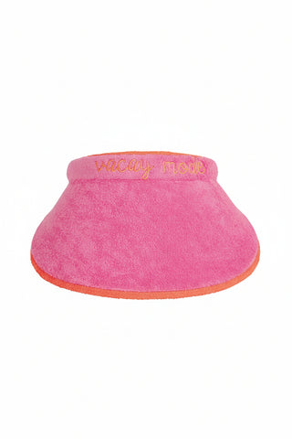 Pink visor with 'vacay mode' text on a white background