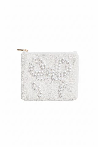 White beaded pouch with a bow design on a white background