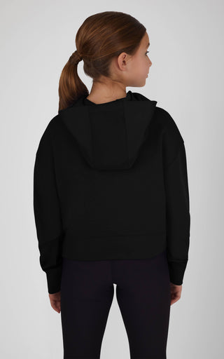 Person wearing a black hoodie from behind on a white background