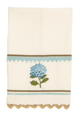 Decorative towel with blue floral design on a white background