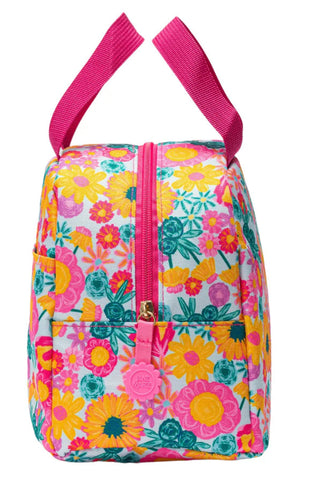 Floral patterned lunch bag with pink straps on a white background