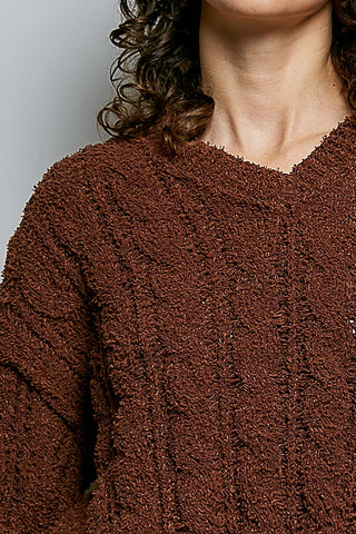 closeup of brown v-neck sweater