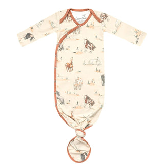 Baby gown with horse pattern on a white background