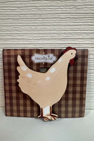 chicken chip clip with checkered cardstock backer in front of a wooden wall