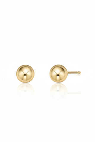 Gold ball stud earrings on a white background