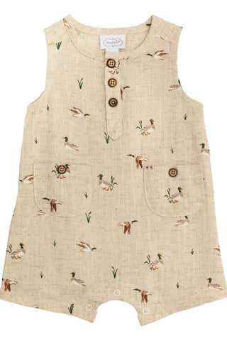 Beige romper with duck pattern on a white background