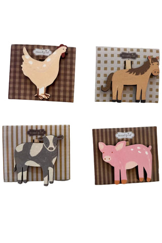 Four wooden chip clips with animals on a white background