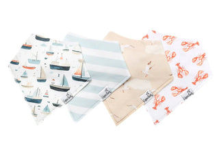 Set of baby bibs with various patterns on a white background