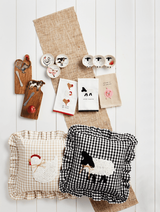Decorative pillows with animal prints on a wooden surface