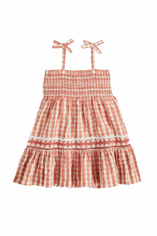 Checkered dress with bow straps on a white background