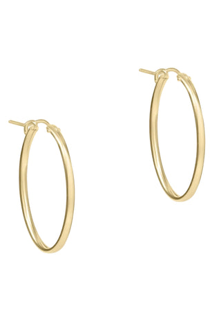 Gold hoop earrings on a white background
