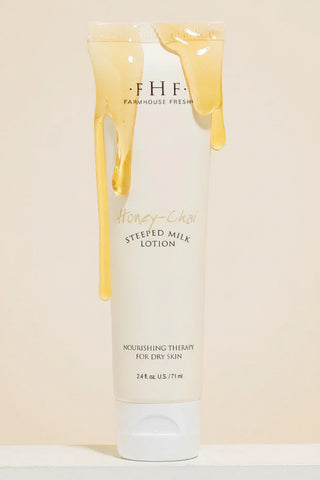 Honey-Chew Steeped Milk Lotion from Farmhouse Fresh on a beige background