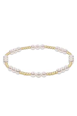 Pearl bracelet with gold accents on a white background