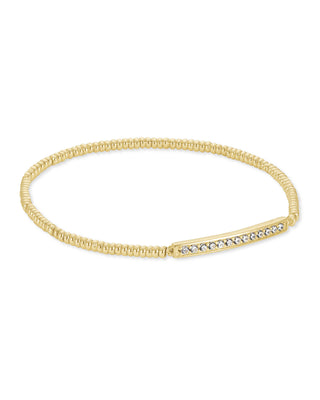 Gold bracelet with embedded crystals on a white background