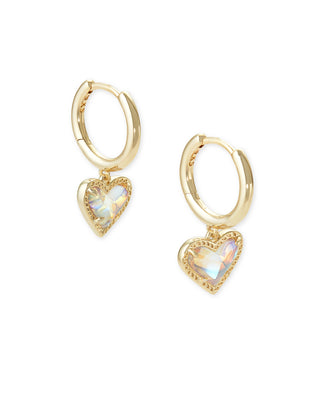 Gold hoop earrings with heart-shaped charms on a white background