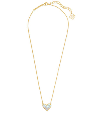Gold necklace with a heart-shaped pendant on a white background